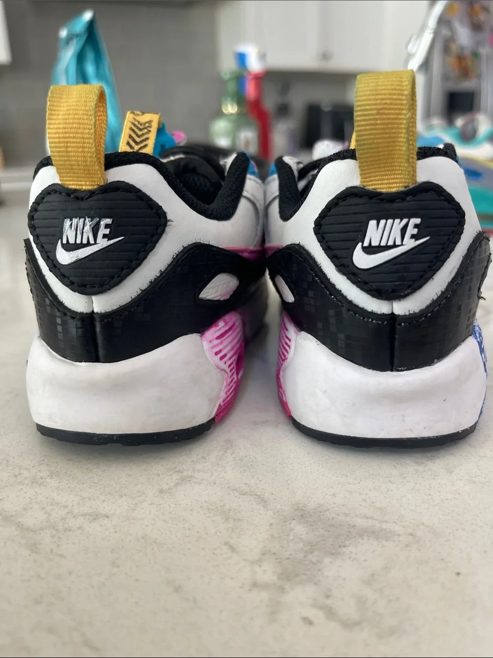 Nike White Kids Sneakers with Pink, Blue & Yellow Accents